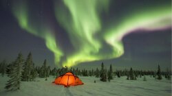 Aurora Borealis In Out Of A Tent Wallpaper