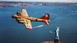 B17 Flying Fortress Over The Statue Of Liberty Wallpaper