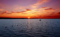Boat In Lake At Sunset Wallpaper