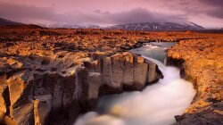Wonderful River Through Sea Of Rocks Wallpaper